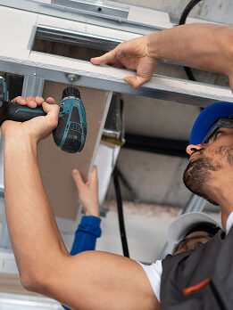 low angle people working with drill 2